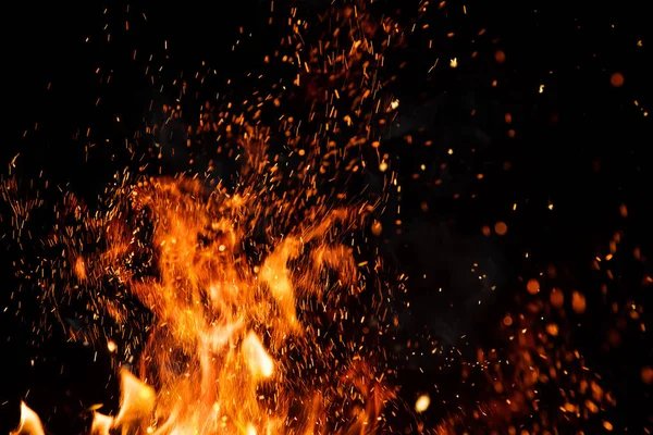Detail of fire sparks isolated on black background — Stock Photo, Image