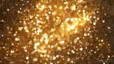 Siyah zemin üzerinde ışıldayan altın parçacıkların süper yavaş çekimi. Sığ odak derinliği. Yüksek hızlı sinema kamerası, 1000 fps..