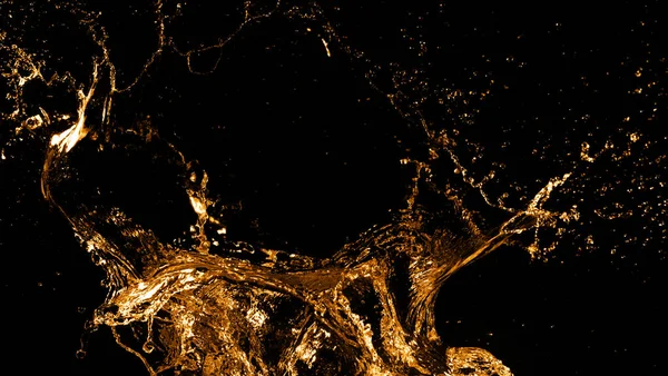 Golden splashes isolated on black background — Stock Photo, Image