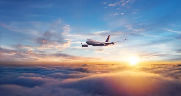 Passengers commercial airplane flying above clouds — Stock Photo, Image