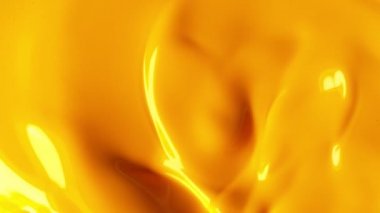 Sarı boya karıştırma süper yavaş hareket. Soyut arka plan. Yüksek hızlı sinema kamera, 1000 fps filme.