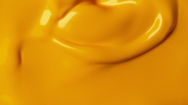 Sarı boya karıştırma süper yavaş hareket. Soyut arka plan. Yüksek hızlı sinema kamera, 1000 fps filme.