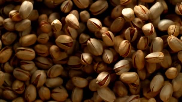 Super Slow Motion Flying Pistachio Nuts Black Background Filmed High — Stock Video