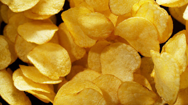 Potatoes fried chips in freeze motion