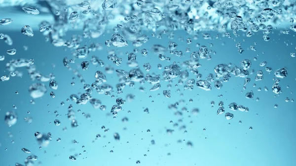 Pęcherzyki wody z miękkim niebieskim tłem — Zdjęcie stockowe