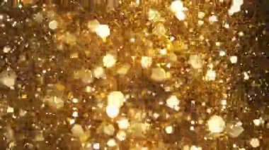 Siyah zemin üzerinde ışıldayan altın parçacıkların süper yavaş çekimi. Sığ odak derinliği. Yüksek hızlı sinema kamerası, 1000 fps..