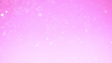 Parlak pembe parçacıkların süper yavaş hareketi. Sığ odak derinliği. Yüksek hızlı sinema kamera, 1000 fps filme.