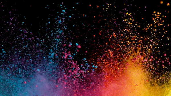 Explosion of colored powder on black background — Stock Photo, Image