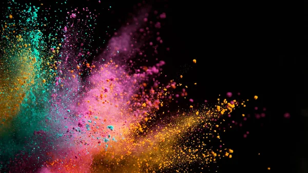 Explosion of colored powder on black background — Stock Photo, Image