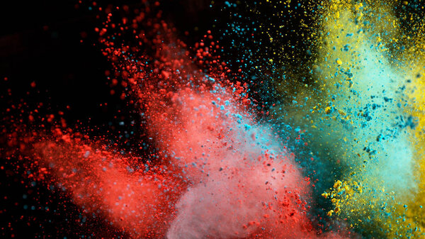 Explosion of colored powder on black background