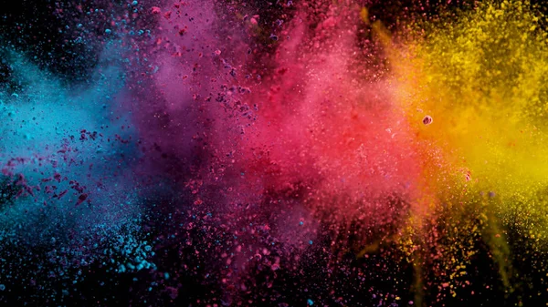 Explosion of colored powder on black background — Stock Photo, Image