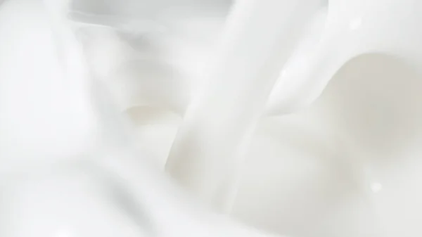 Macro shot of pouring cream in detail — Stock Photo, Image