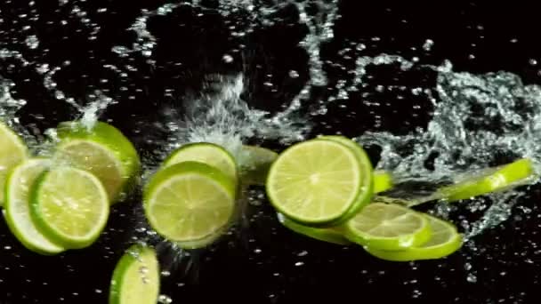 Super Slow Motion Lime Pieces Collision Water Splashes Black Background — Stock Video