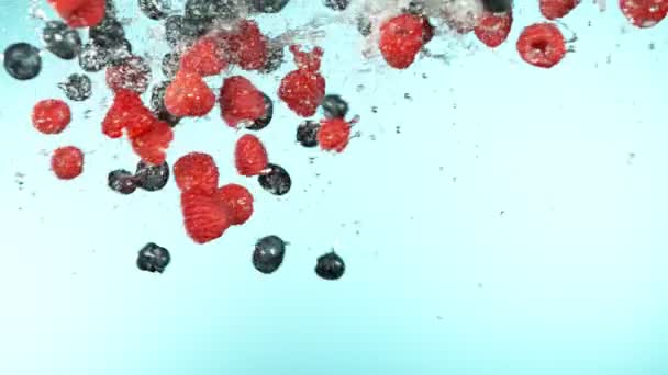 Slow Motion Raspberries Blueberries Flying Air Water Splashes Filmed High — Stock Video