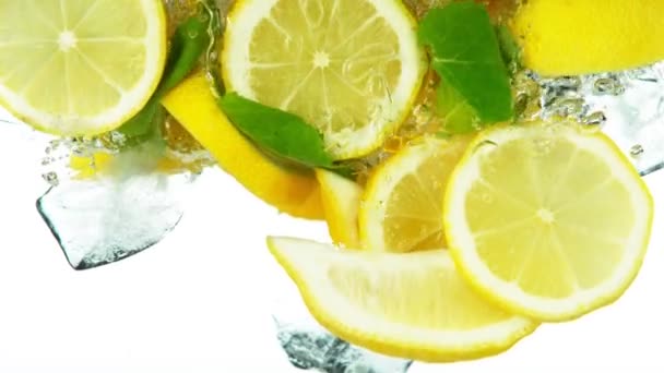 Super Slow Motion Lemon Slices Falling Water Ice Cubes White — Stock Video