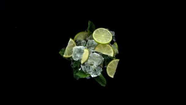 Super Slow Motion Rotating Crushed Ice Lime Slices Black Background — Stock Video