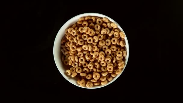 Super Slow Motion Rotating Cereal Rings Milk Splashes Black Background — Stock Video