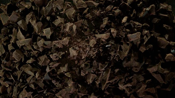 Freeze Motion Flying Group Raw Chocolate Pieces Isolated Black Background — Stock Photo, Image