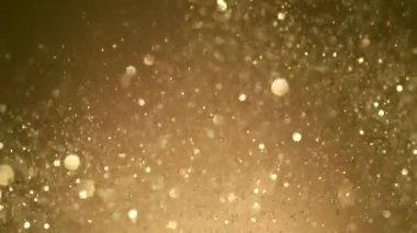 Siyah arkaplanda ışıldayan renkli parçacıkların süper yavaş çekimi. Sığ odak derinliği. Yüksek hızlı sinema kamerası, 1000 fps..