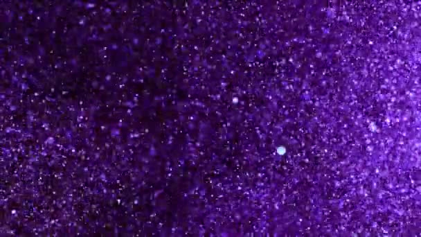 Super Slow Motion Glittering Coloured Particles Black Background Shallow Depth — Stock Video