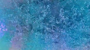 Soyut renklerin süper yavaş çekimleri üstten çekilen patlamaları vuruyor. Yüksek hızlı sinema kamerası, 1000 fps..