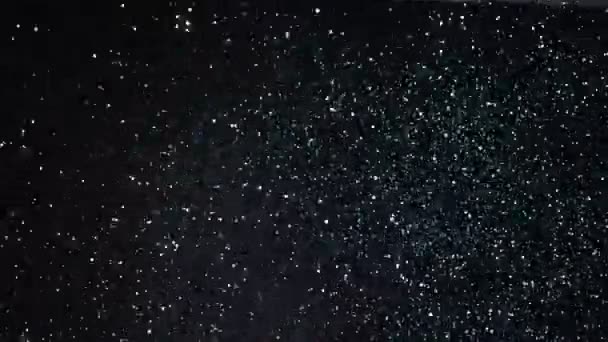 Super Slow Motion Glittering Particles Black Background Shallow Depth Focus — Stock Video