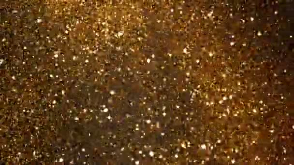 Super Pomalý Pohyb Třpytivých Zlatých Částic Černém Pozadí Mělká Hloubka — Stock video