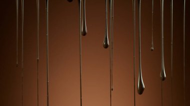 Yumuşak arkaplanda erimiş çikolata damlıyor, soyut arkaplan