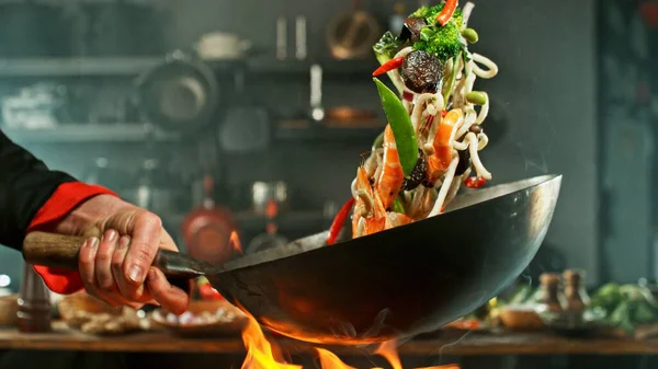 Freeze Motion Wok Pan Flying Ingredients Air Kitchen Background Stock Image