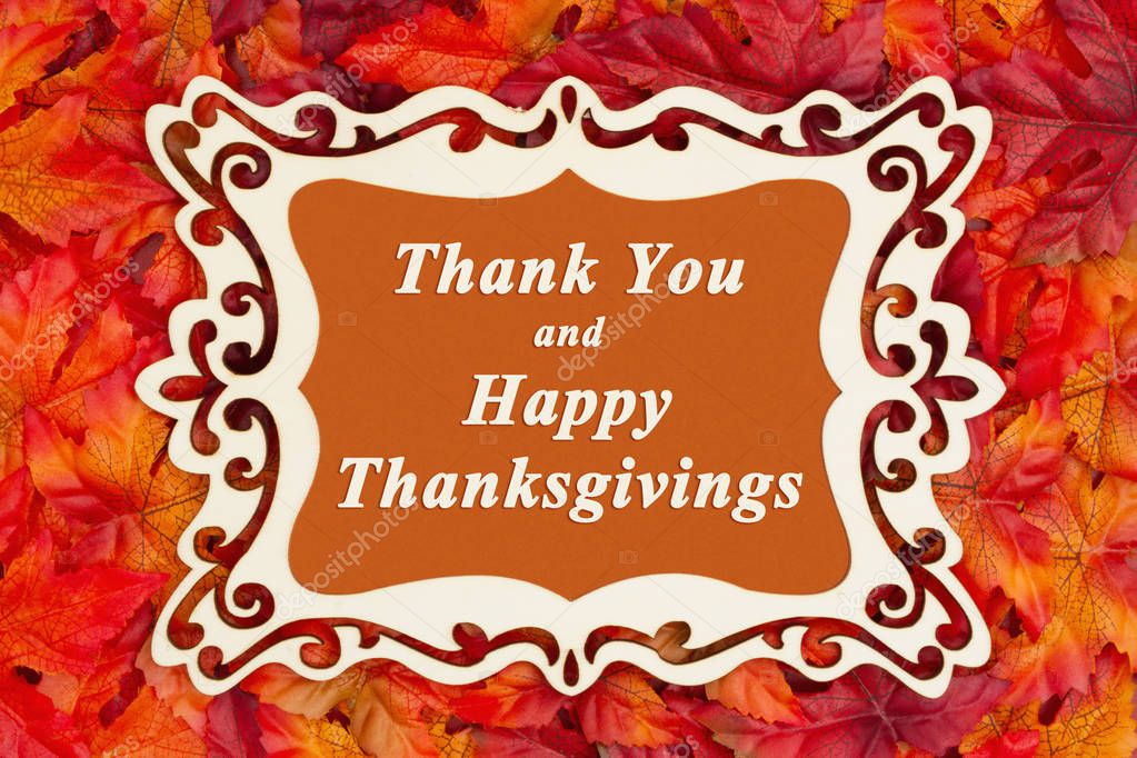 Happy Thanksgiving greeting with a fancy wood frame and fall leaves with Thank You