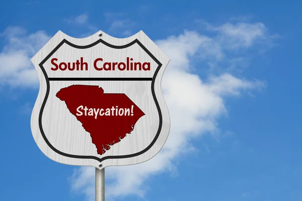 South Carolina Staycation Highway Sign, South Carolina map and text Staycation on a highway sign with sky background