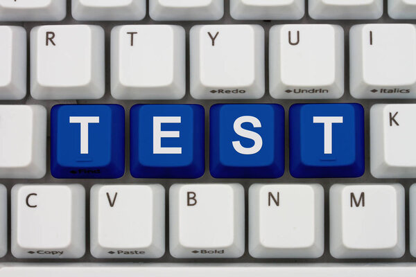 Taking a test on line, A close-up of a keyboard with blue highlighted text Test