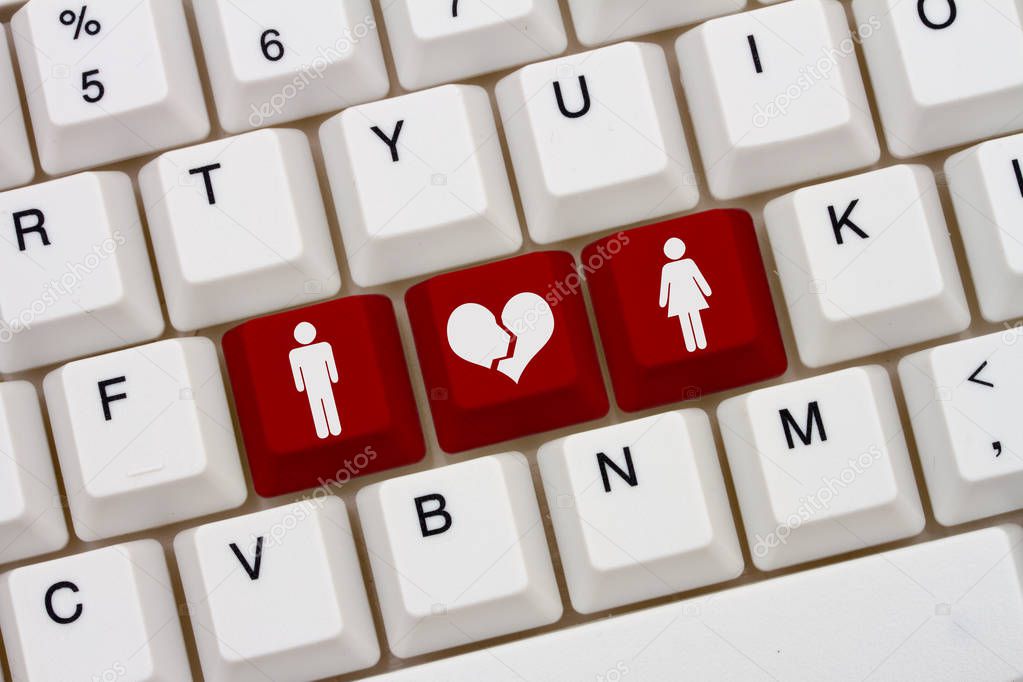Dating on the internet gone wrong, A close-up of a keyboard with red highlighted text with woman and man symbol and broken heart