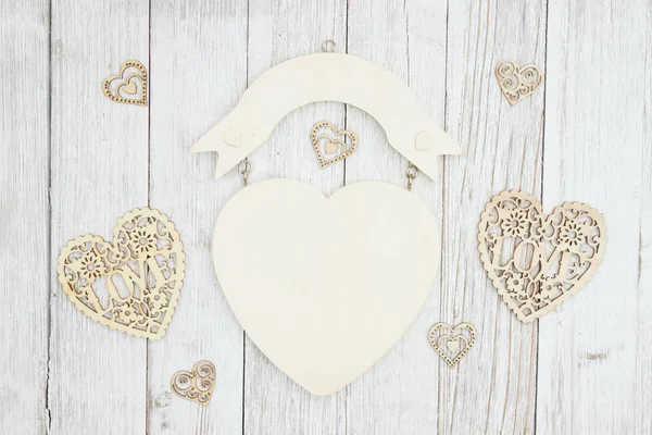 Wood heart sign on weathered whitewash textured wood