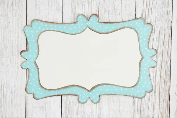 Tin polka dot picture frame on weathered whitewash textured wood — Stock Photo, Image