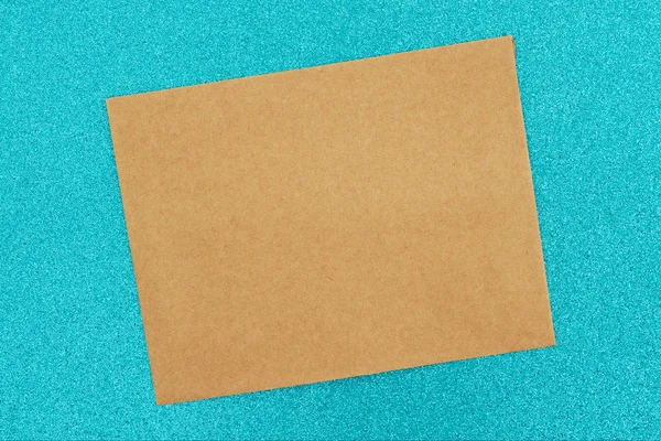 Kağıt boş kahverengi tebrik kartı deniz mavisi glitter — Stok fotoğraf