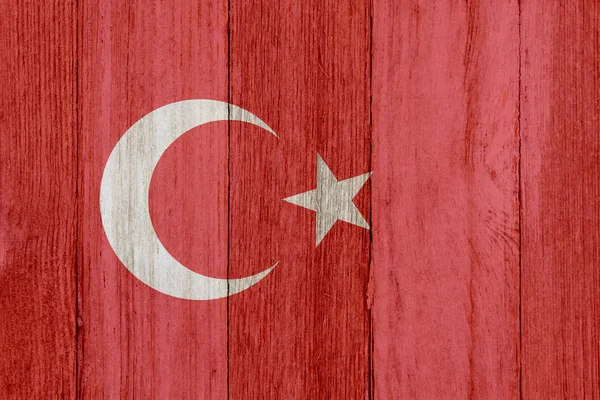 A rustic old Turkish flag on weathered wood — Stock Photo, Image