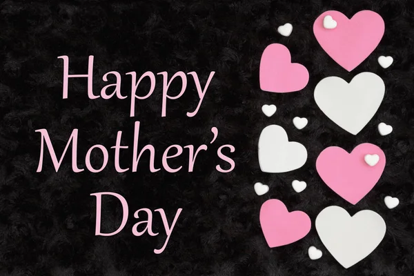 Happy Mother's Day greeting with white and pink hearts with cand — Stock Photo, Image