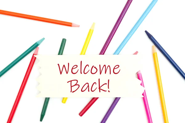 Welcome back message on wood sign with colored watercolor pencil — Stock Photo, Image
