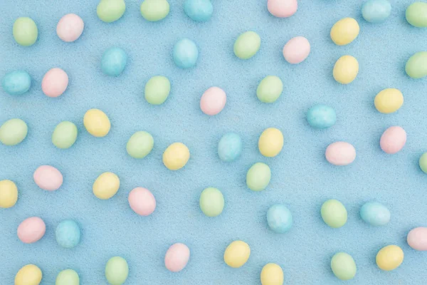 Candy Pascua huevo fondo azul material — Foto de Stock