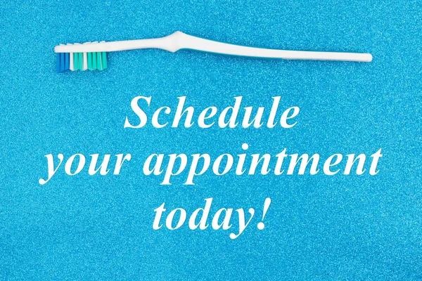 Schedule your appointment today text with toothbrush — Stock Photo, Image