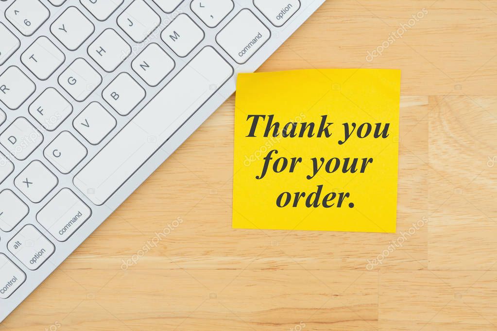 Thank you for your order text on a sticky note with a keyboard