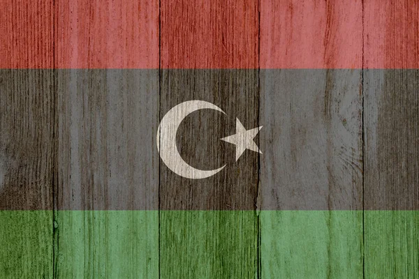 Yıpranmış ahşap üzerinde rustik eski Libya bayrağı — Stok fotoğraf