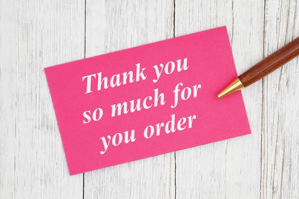Muito obrigado por seu texto de pedido no cartão rosa com caneta — Fotografia de Stock