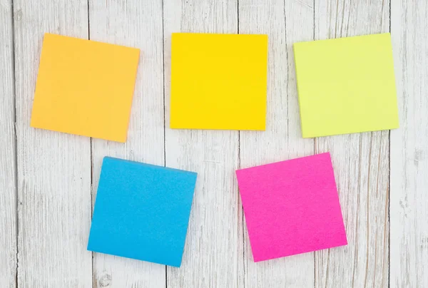 Five blank sticky notes on weathered whitewash textured wood bac — Stock Photo, Image