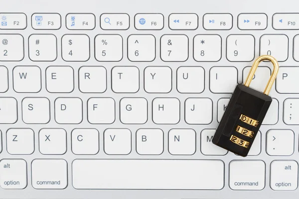 Combination lock on a keyboard — Stock Photo, Image