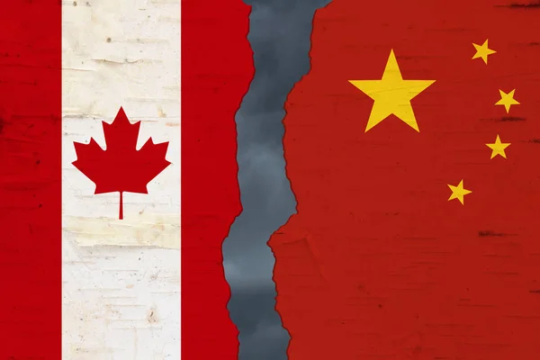 Canadian and Chinese flags that are torn apart — Stock Photo, Image