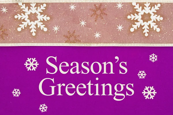 Season\'s Greeting message with gold snowflake ribbon