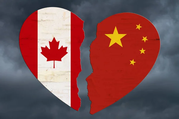 Banderas canadienses y chinas en un corazón roto — Foto de Stock