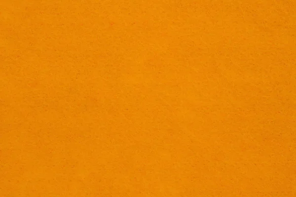 明るいオレンジのテクスチャーフェルト生地の背景 — ストック写真